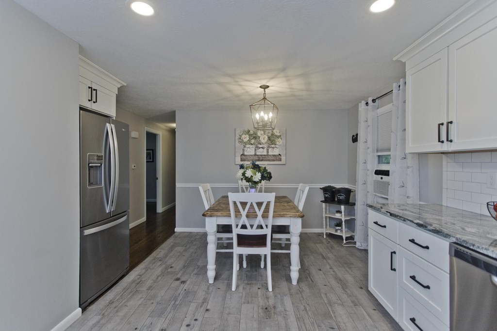 1041 Burts Pit Road Northampton, MA 01062 - Photo 6 of 22 a view of a dining room with furniture and wooden floor