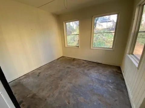 an empty room with windows