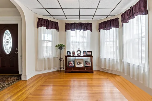 a view of a livingroom with furniture and staircase