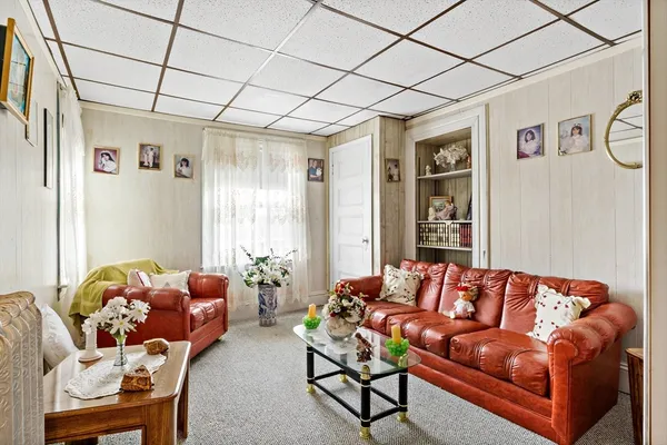 a bedroom with a bed and a mirror