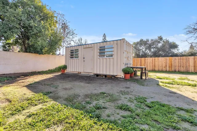 a view of a backyard of the house