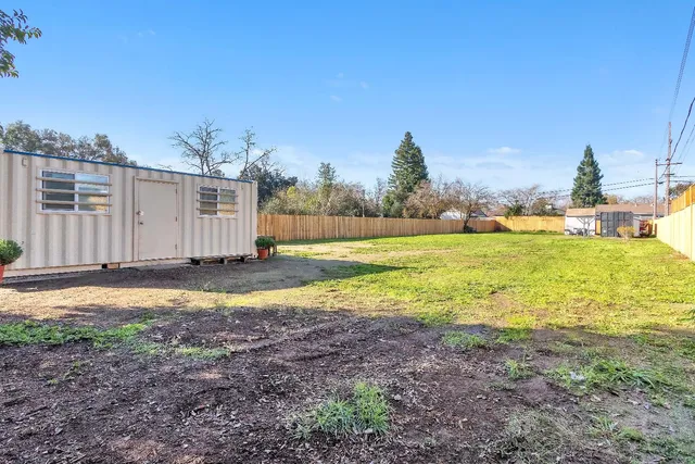 a view of a yard with an ocean