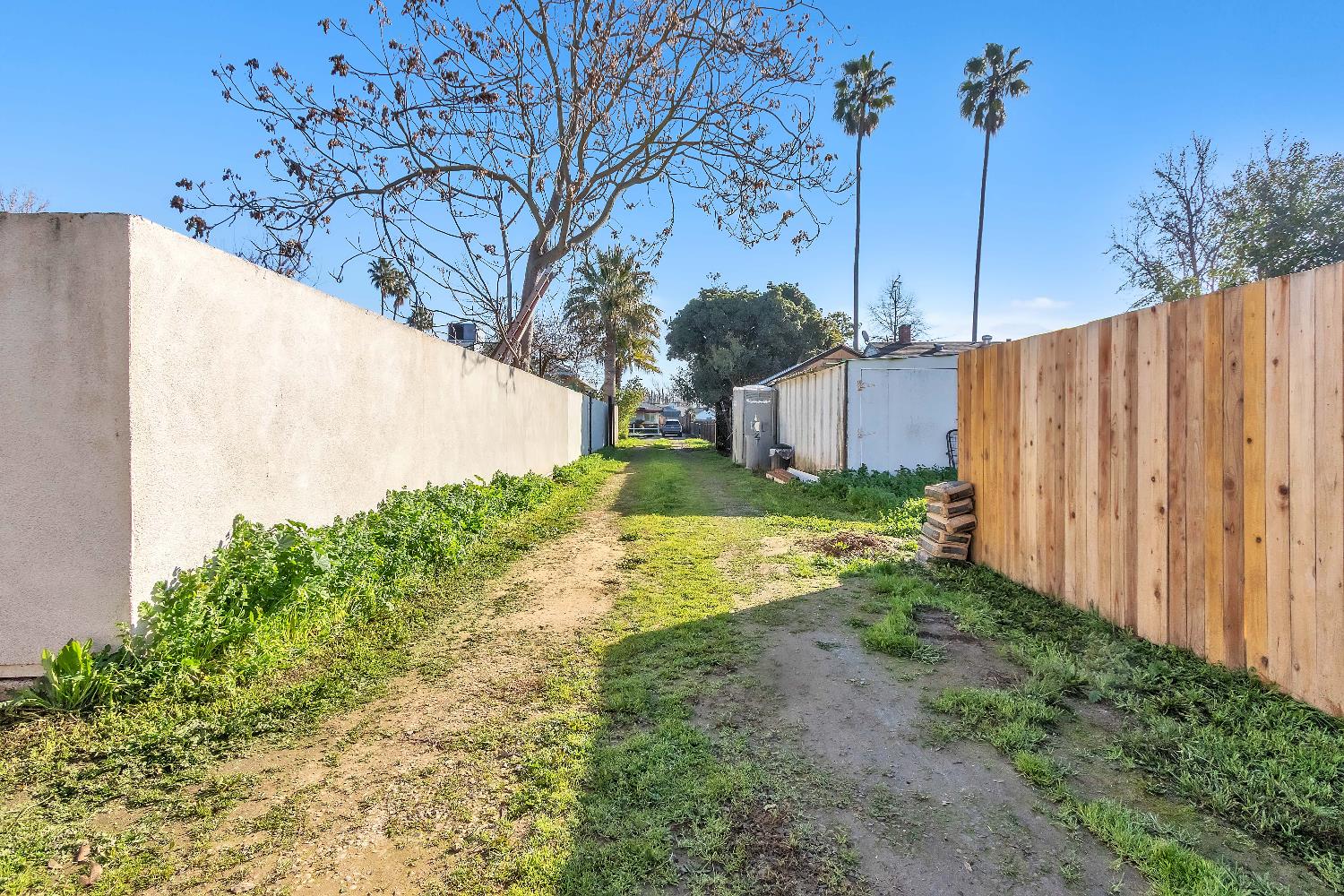 4194 63rd Street Sacramento, CA 95820 - Photo 3 of 41 a view of a yard with wooden fence