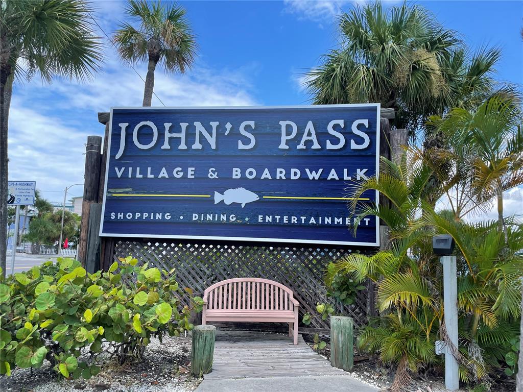 175 133rd Avenue East, Unit WEST Madeira Beach, FL 33708 - Photo 13 of 15 a sign on the side of a building