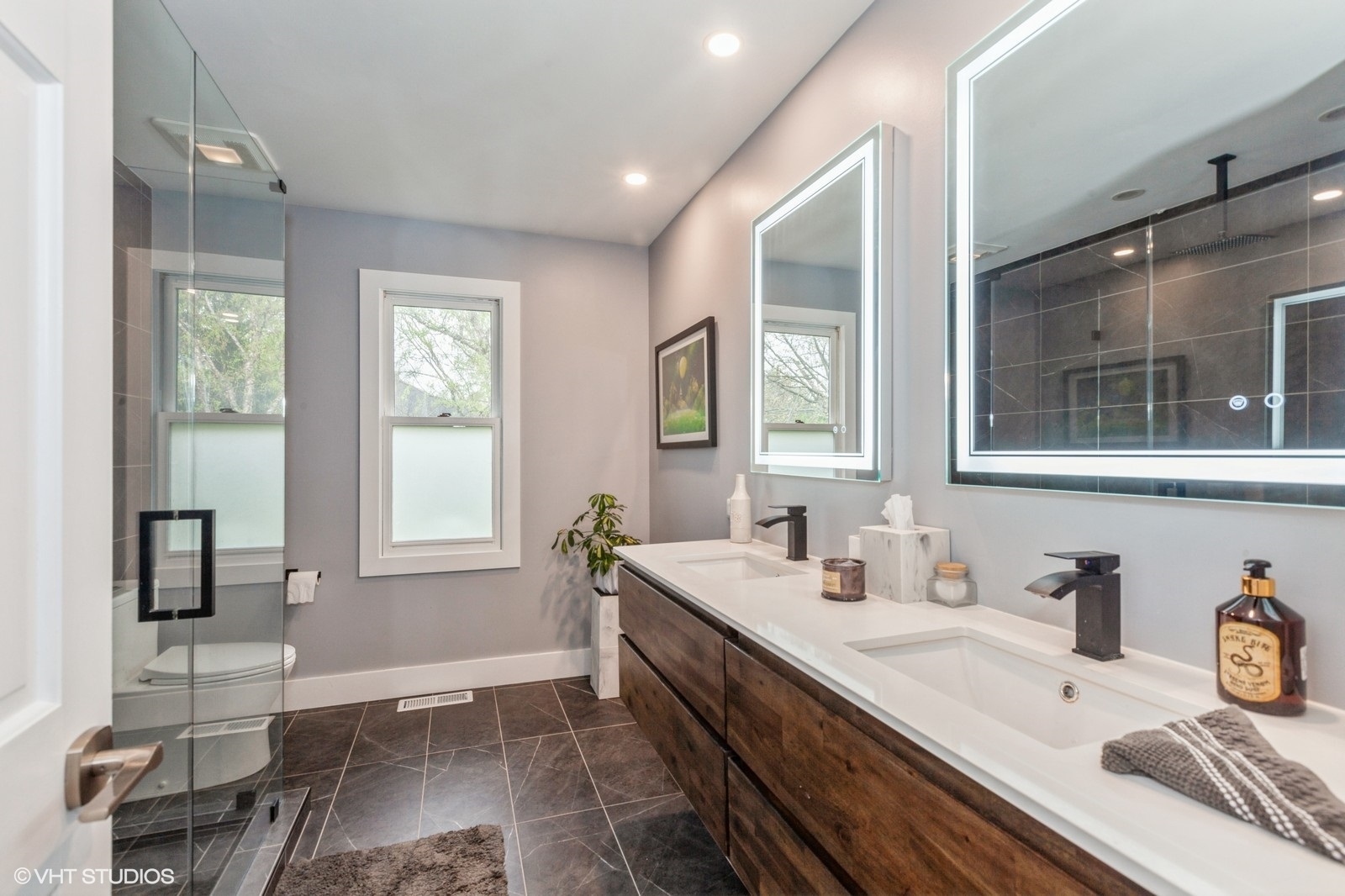 446 Quail Drive Naperville, IL 60565 - Photo 17 of 24 a bathroom with double vanity and a window