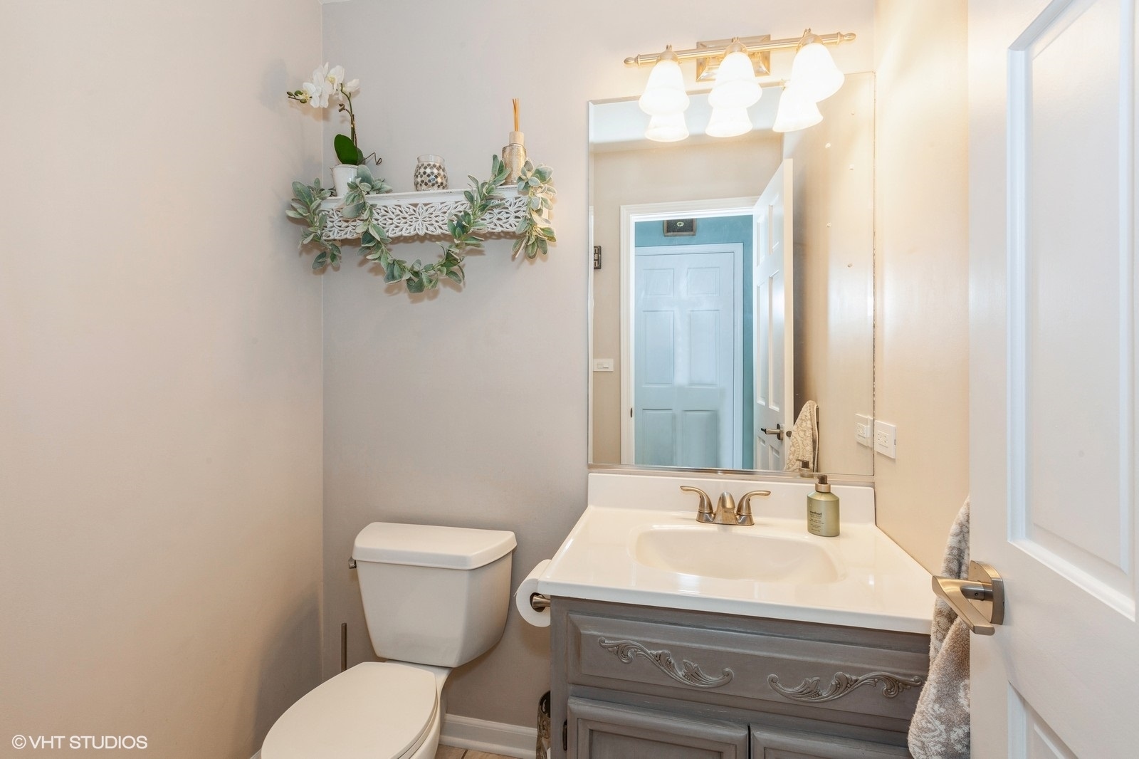 446 Quail Drive Naperville, IL 60565 - Photo 10 of 24 a bathroom with a sink mirror and toilet