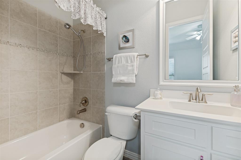 506 Life Spring Drive Rockwall, TX 75087 - Photo 27 of 36 a bathroom with a sink toilet and shower