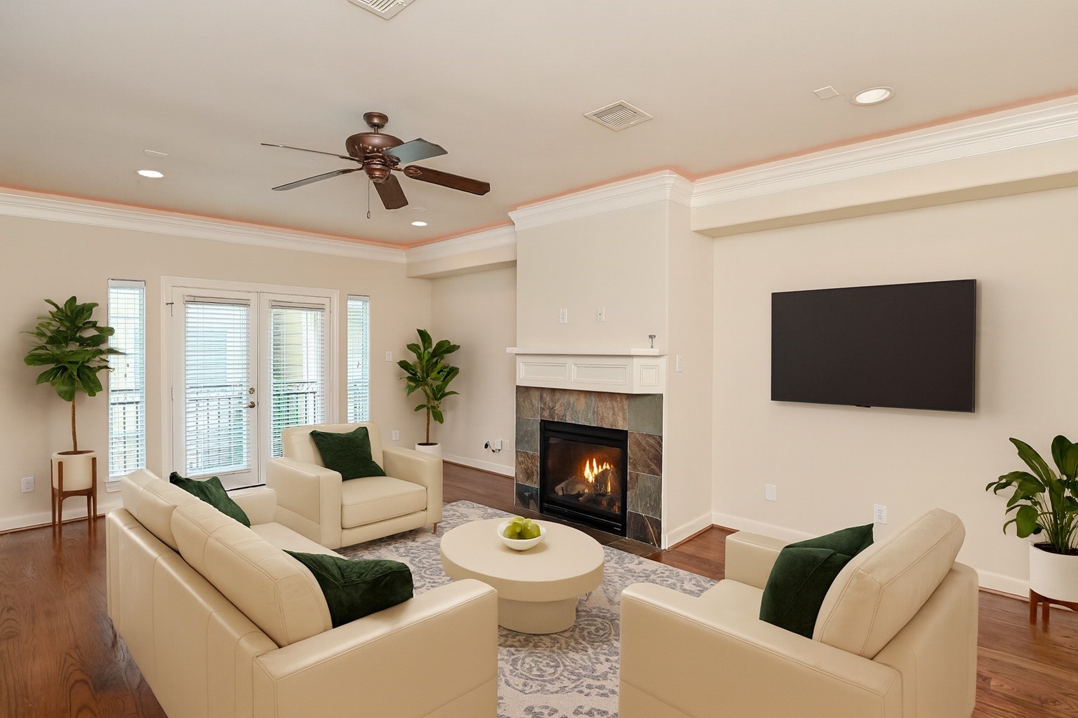 5813 Washington Avenue, Unit B Houston, TX 77007 - Photo 2 of 36 a living room with furniture a fireplace and a flat screen tv