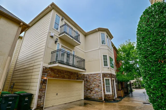 a front view of a house with garage