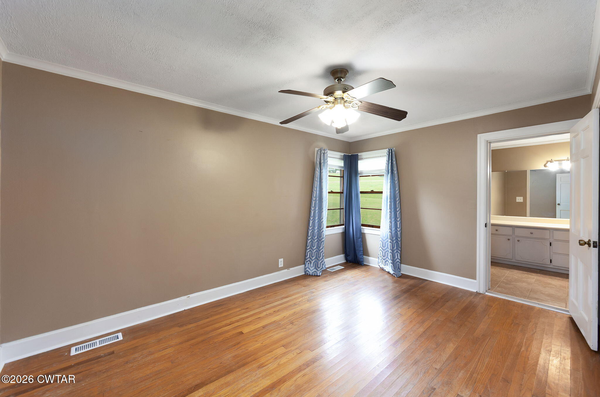 118 Radio Road Jackson, TN 38301 - Photo 15 of 22 wooden floor in an empty room with a window