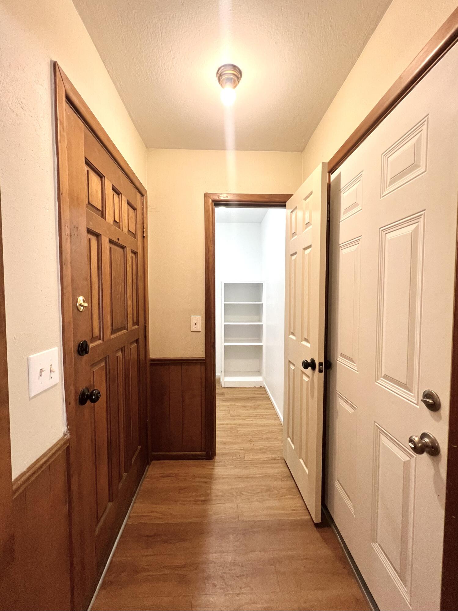 5113 13th Street, Unit A Lubbock, TX 79416 - Photo 2 of 25 a view of a hallway with wooden floor and closet area