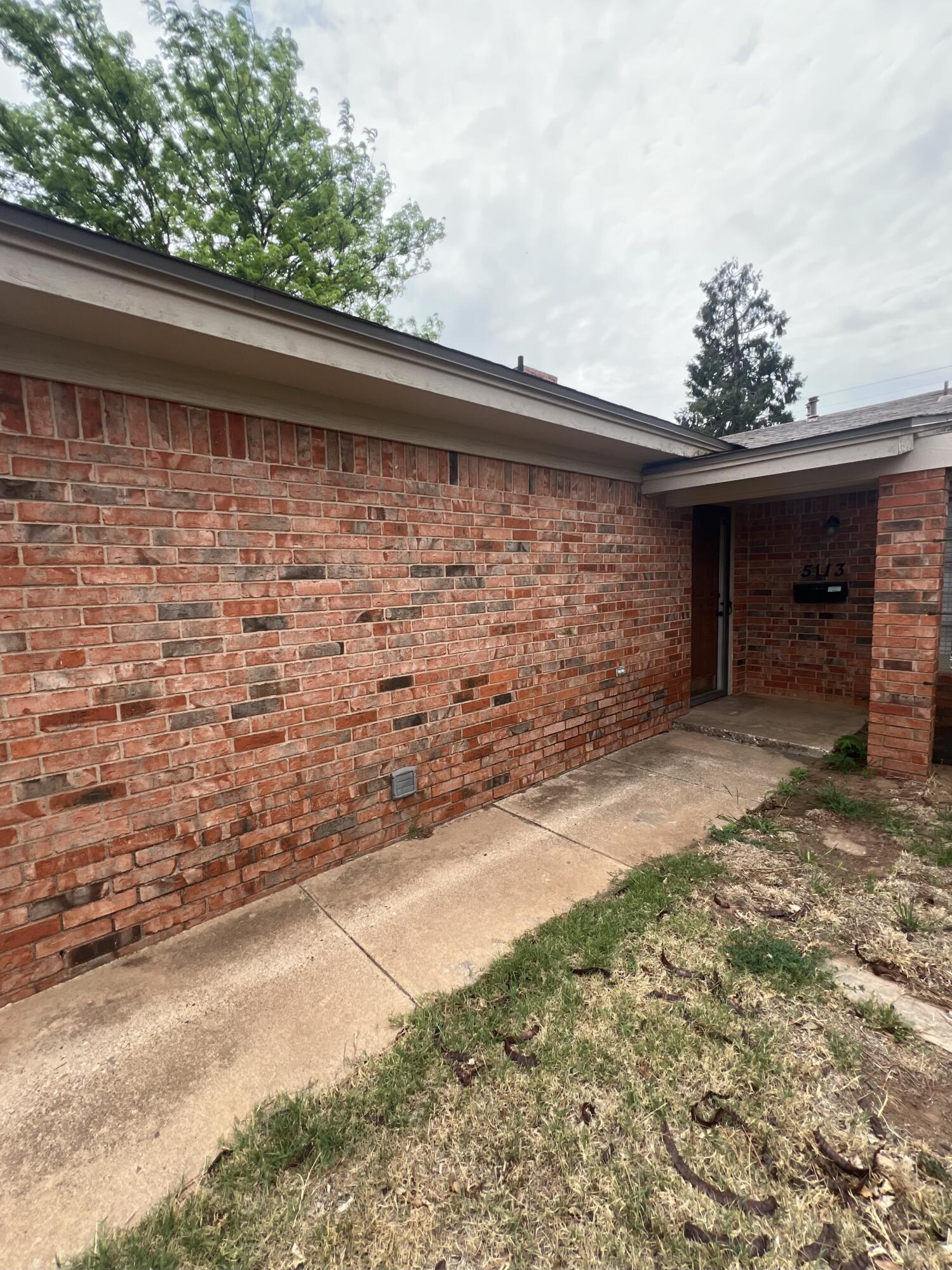 5113 13th Street, Unit A Lubbock, TX 79416 - Photo 23 of 25 a view of a backyard of the house