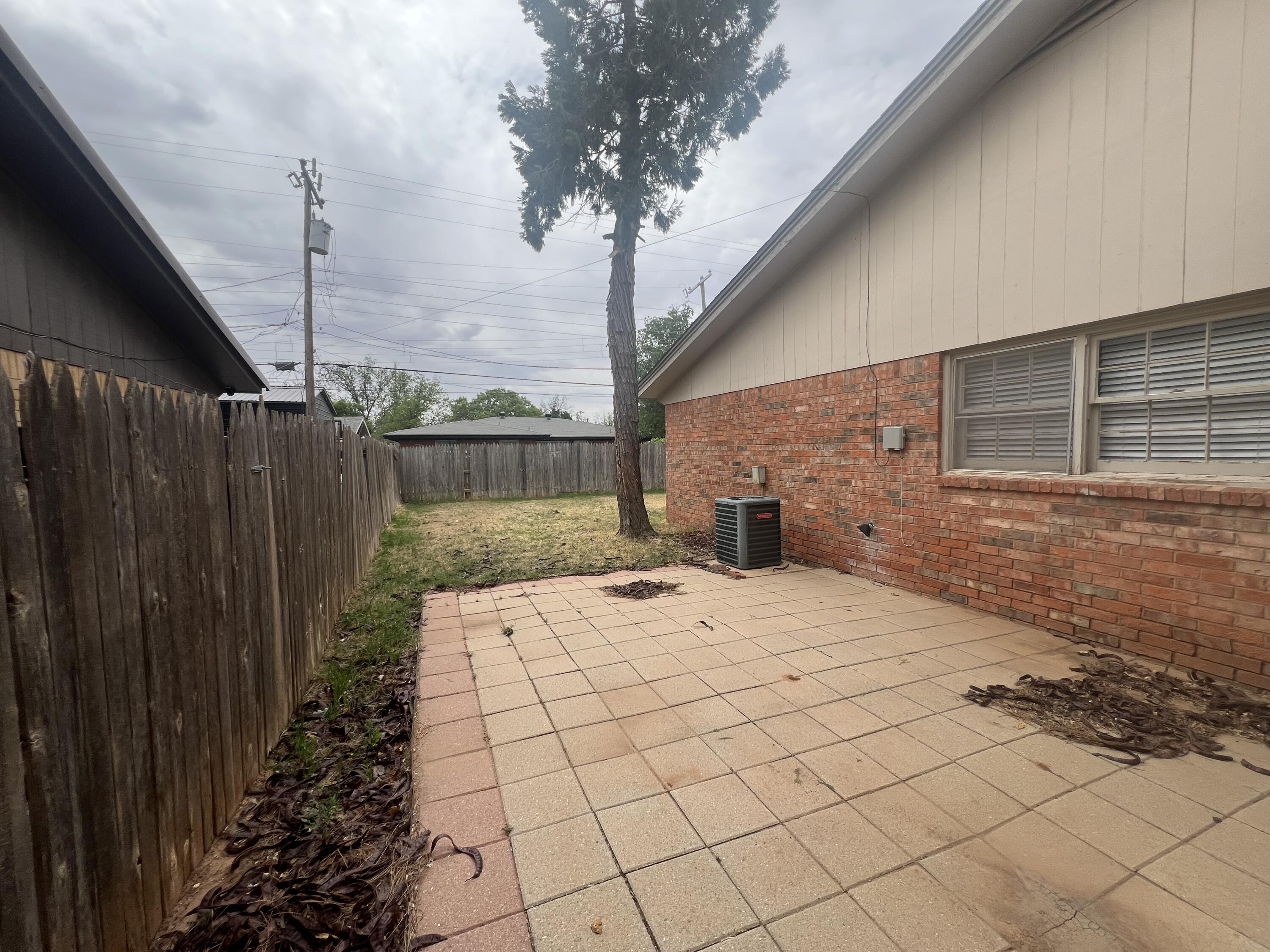 5113 13th Street, Unit A Lubbock, TX 79416 - Photo 24 of 25 a view of a backyard of the house