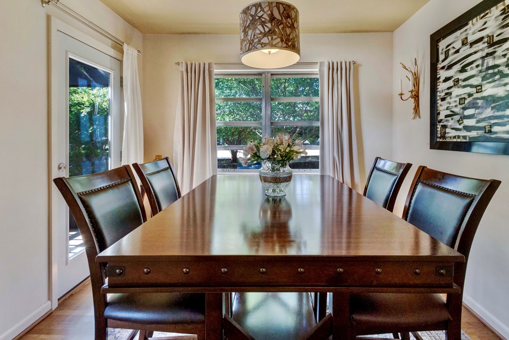207 East Walnut Street Fredericksburg, TX 78624 - Photo 12 of 42 a view of a dining room with furniture window and wooden floor