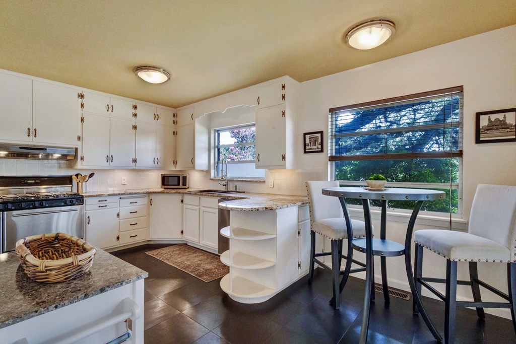 207 East Walnut Street Fredericksburg, TX 78624 - Photo 16 of 42 a kitchen with a sink cabinets and window