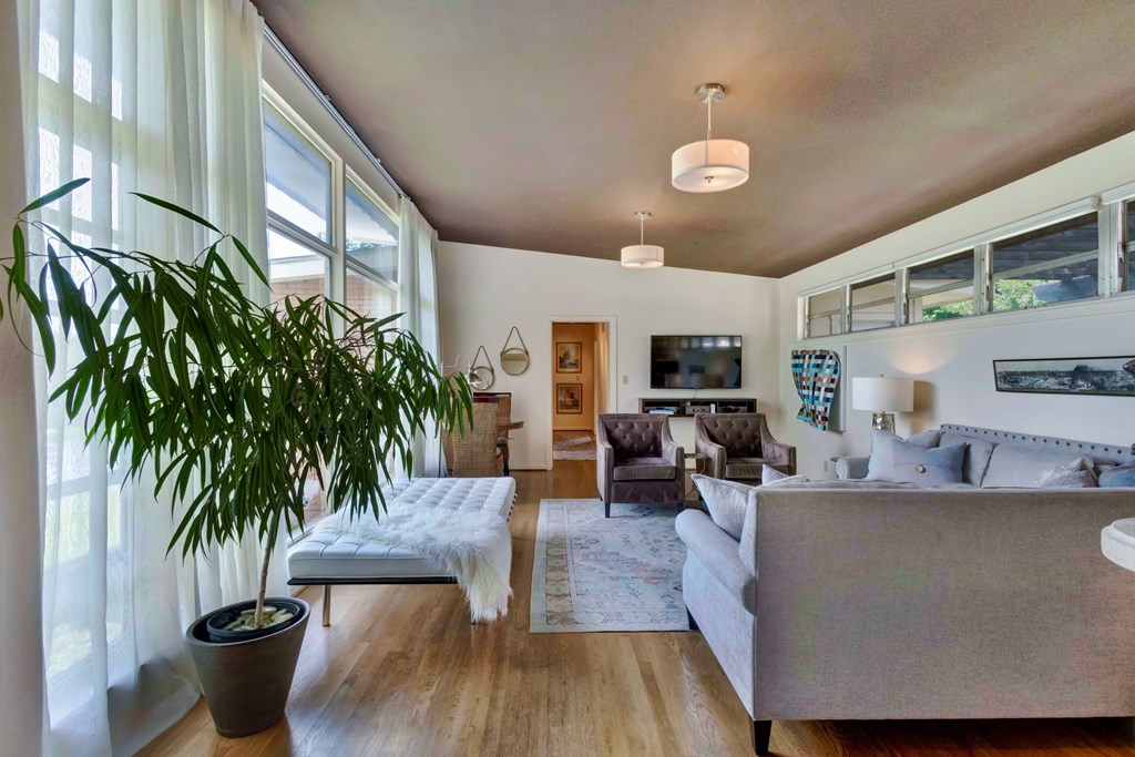 207 East Walnut Street Fredericksburg, TX 78624 - Photo 2 of 42 a living room with furniture and a large window
