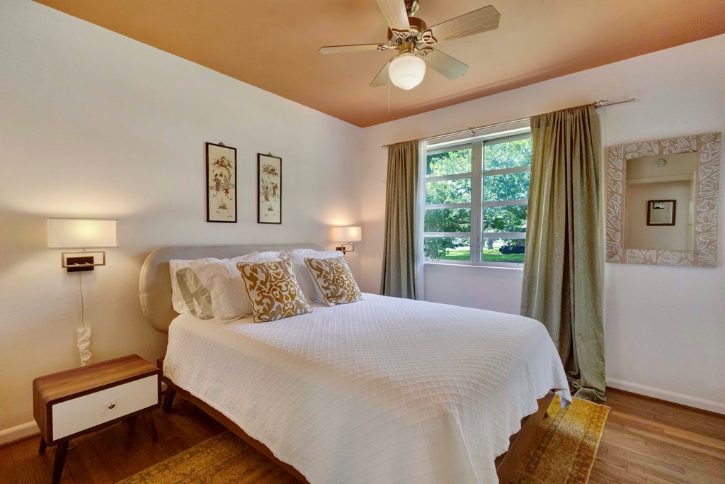 207 East Walnut Street Fredericksburg, TX 78624 - Photo 22 of 42 a bedroom with a bed and a window