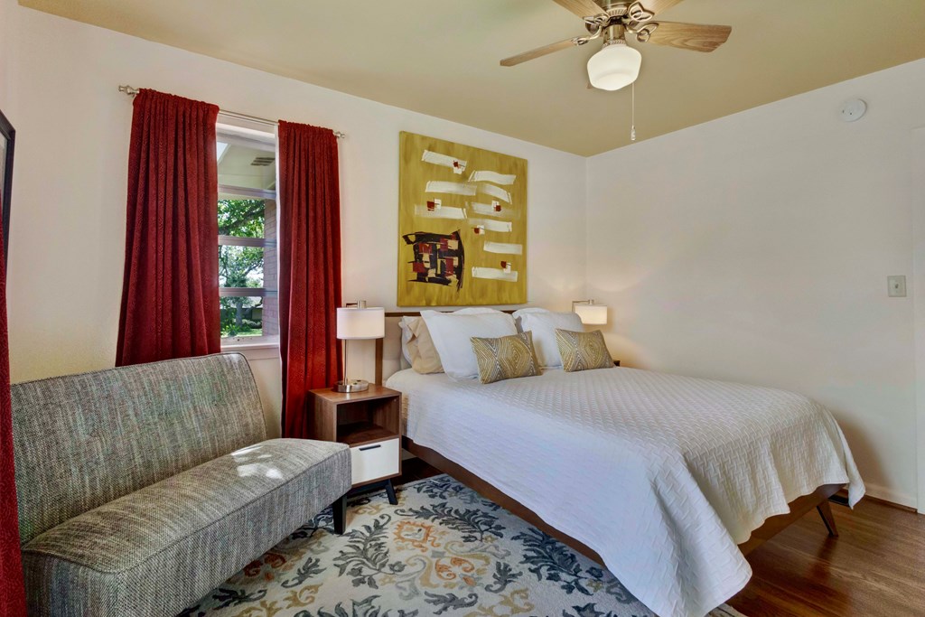 207 East Walnut Street Fredericksburg, TX 78624 - Photo 23 of 42 a bedroom with a bed and a couch