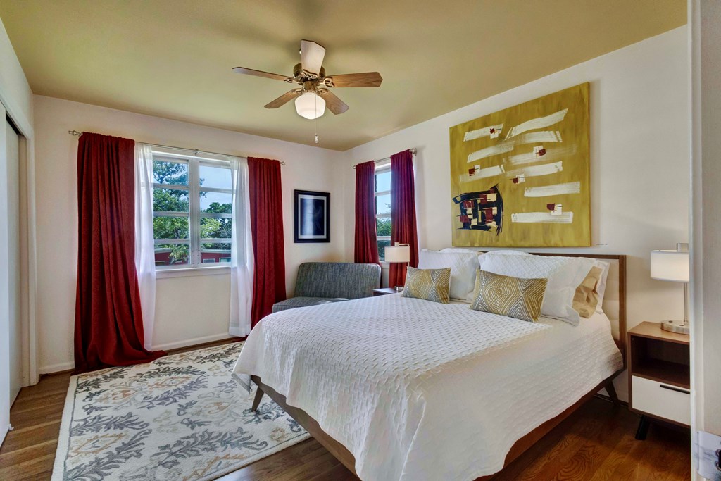 207 East Walnut Street Fredericksburg, TX 78624 - Photo 24 of 42 a bed sitting in a bedroom next to a window