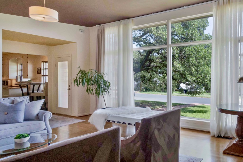 207 East Walnut Street Fredericksburg, TX 78624 - Photo 3 of 42 a living room with furniture and a large window