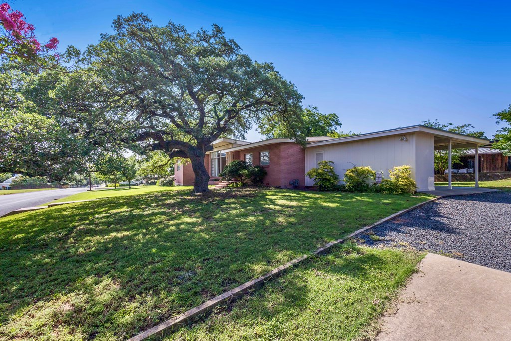 207 East Walnut Street Fredericksburg, TX 78624 - Photo 35 of 42 a front view of house with garden