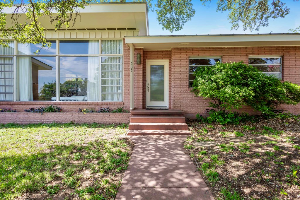 207 East Walnut Street Fredericksburg, TX 78624 - Photo 37 of 42 a view of a house with backyard and sitting area