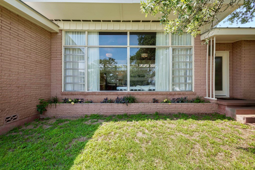 207 East Walnut Street Fredericksburg, TX 78624 - Photo 38 of 42 a view of house with backyard and garden