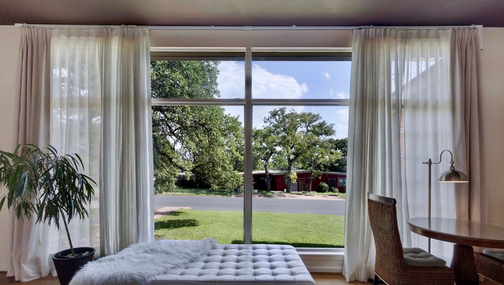 207 East Walnut Street Fredericksburg, TX 78624 - Photo 5 of 42 a view of porch with a bench and floor to ceiling window