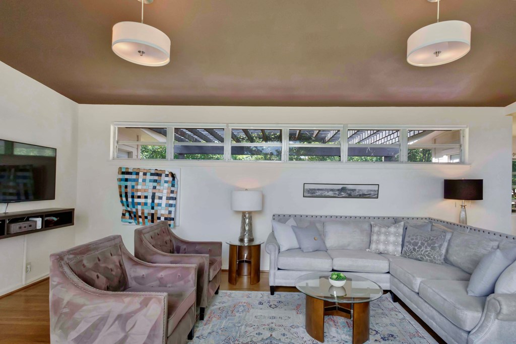 207 East Walnut Street Fredericksburg, TX 78624 - Photo 7 of 42 a living room with furniture and a flat screen tv