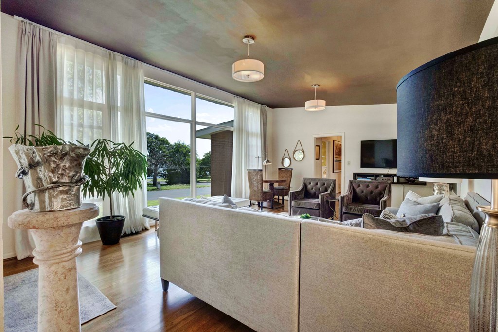 207 East Walnut Street Fredericksburg, TX 78624 - Photo 9 of 42 a living room with furniture and a large window