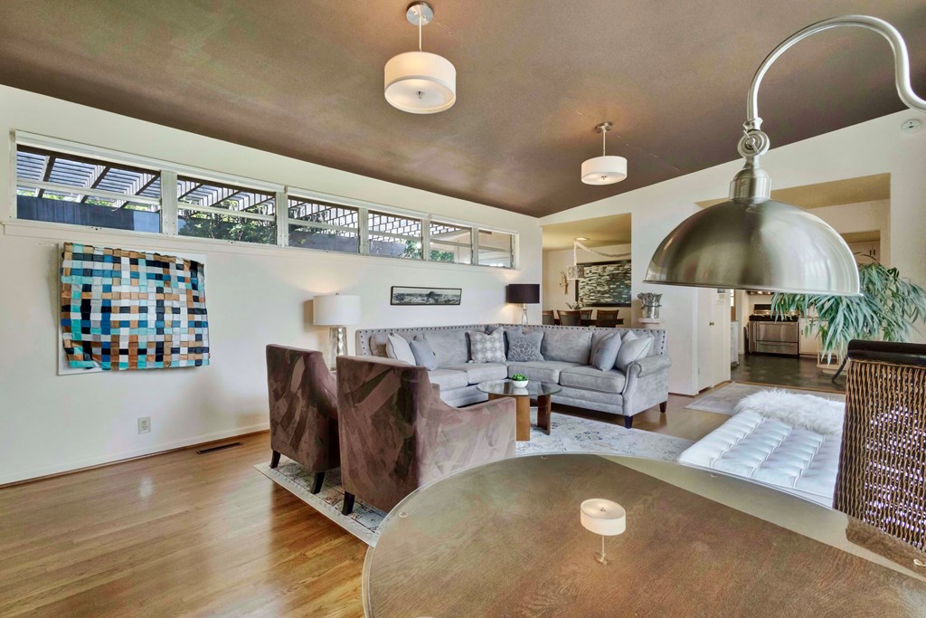 207 East Walnut Street Fredericksburg, TX 78624 - Photo 10 of 42 a living room with furniture and wooden floor