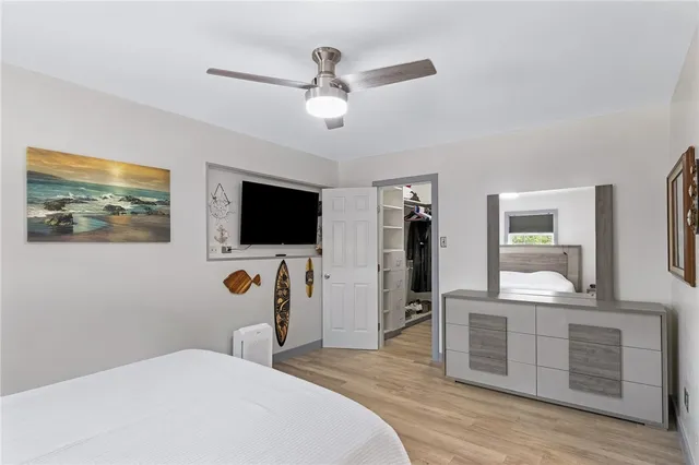 a bedroom with a bed and cabinets