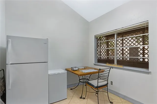 a kitchen with a stove a sink and a refrigerator