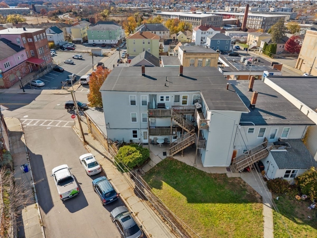 1498-1508 Pleasant Street Fall River, MA 02723 - Photo 4 of 8 an aerial view of residential houses with outdoor space