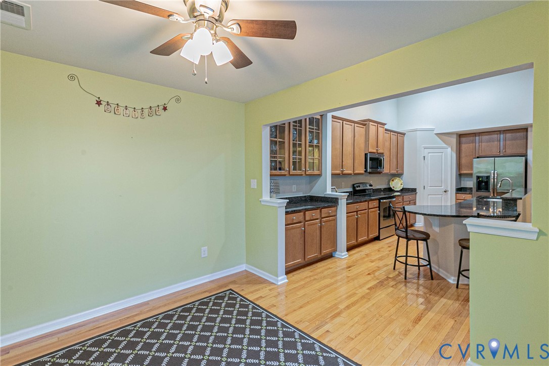 7533 South Franklins Way Quinton, VA 23141 - Photo 16 of 46 a kitchen with a refrigerator and a stove top oven