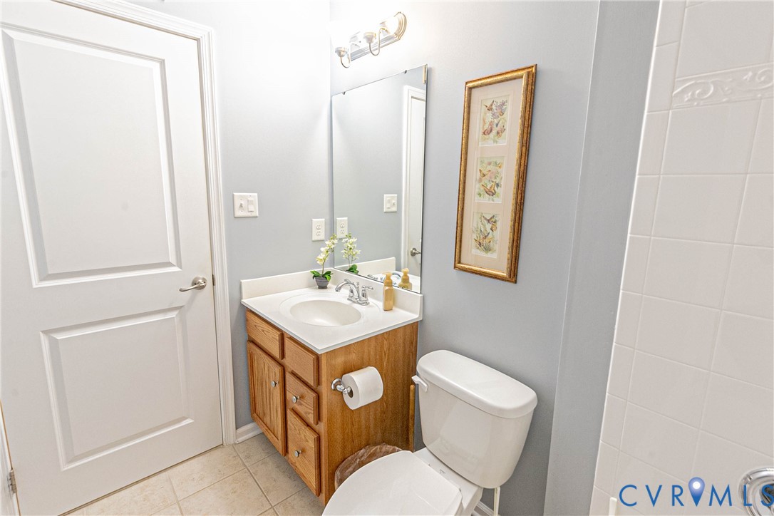 7533 South Franklins Way Quinton, VA 23141 - Photo 20 of 46 a bathroom with a toilet a sink and mirror