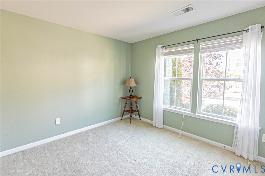 7533 South Franklins Way Quinton, VA 23141 - Photo 22 of 46 a view of room with window and a ceiling fan