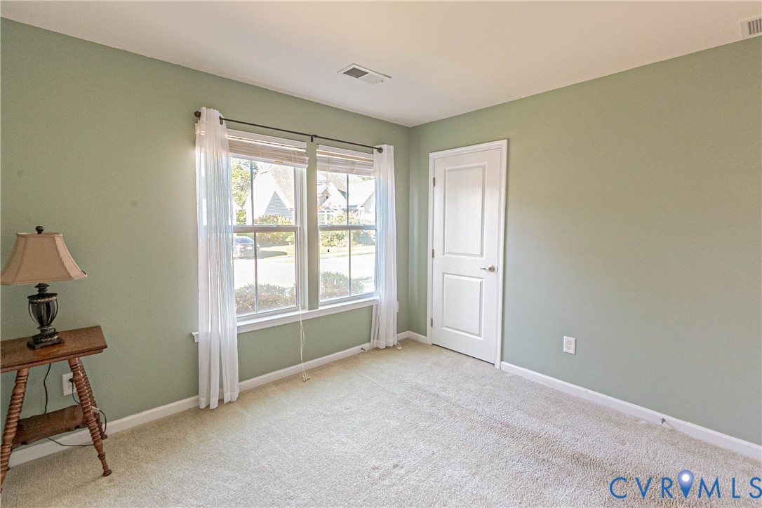 7533 South Franklins Way Quinton, VA 23141 - Photo 23 of 46 a view of an empty room with a window