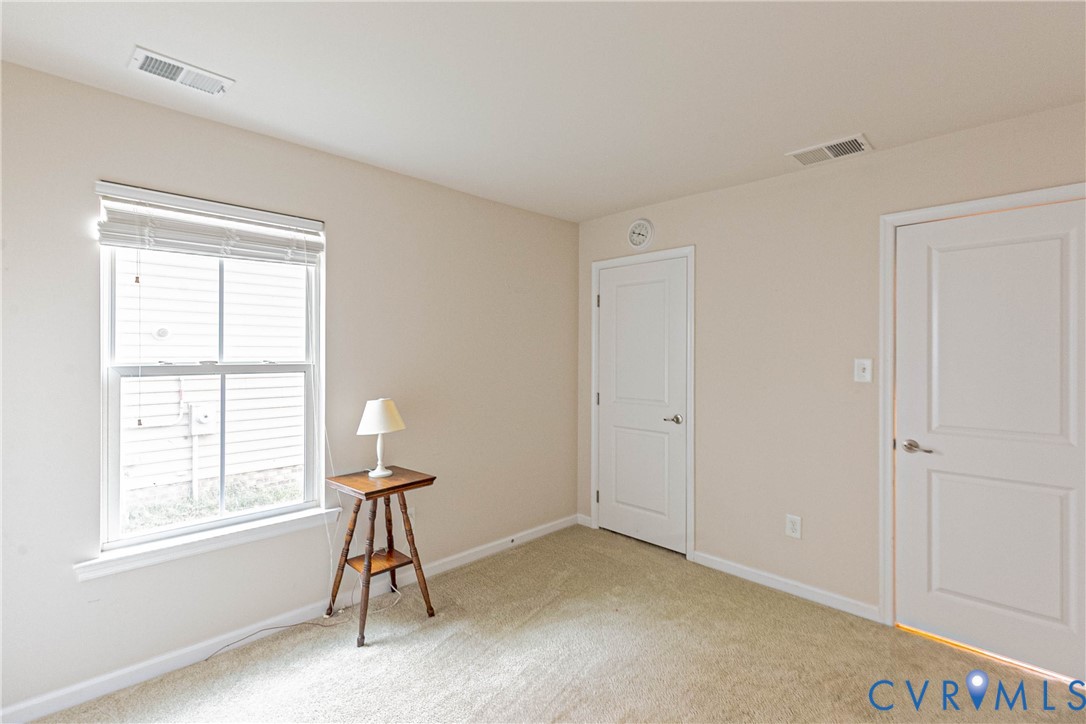 7533 South Franklins Way Quinton, VA 23141 - Photo 25 of 46 a view of empty room with windows