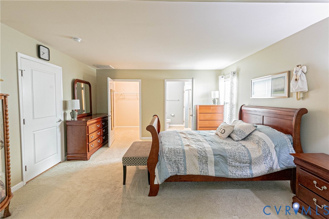 7533 South Franklins Way Quinton, VA 23141 - Photo 28 of 46 a bedroom with a bed and furniture
