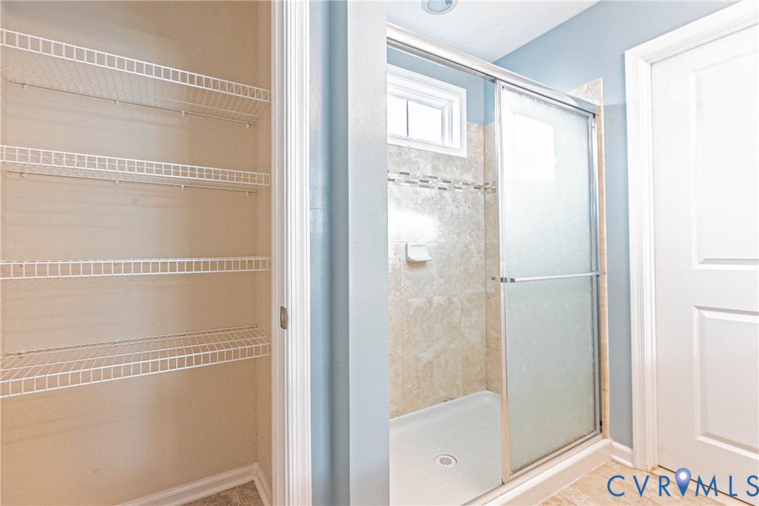 7533 South Franklins Way Quinton, VA 23141 - Photo 33 of 46 a bathroom with a glass shower door