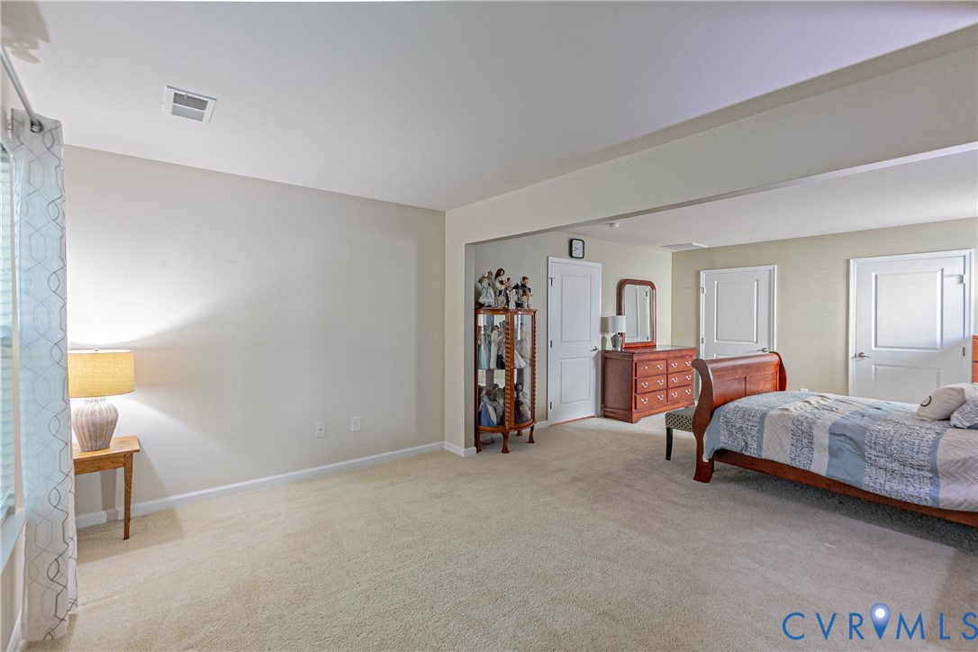 7533 South Franklins Way Quinton, VA 23141 - Photo 37 of 46 a bed room with a bed and a lamp