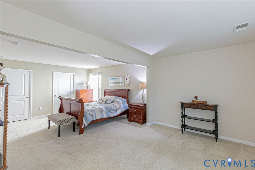 7533 South Franklins Way Quinton, VA 23141 - Photo 38 of 46 a bedroom with bed and window