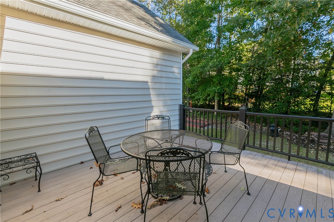 7533 South Franklins Way Quinton, VA 23141 - Photo 45 of 46 a view of a chairs and table on the deck