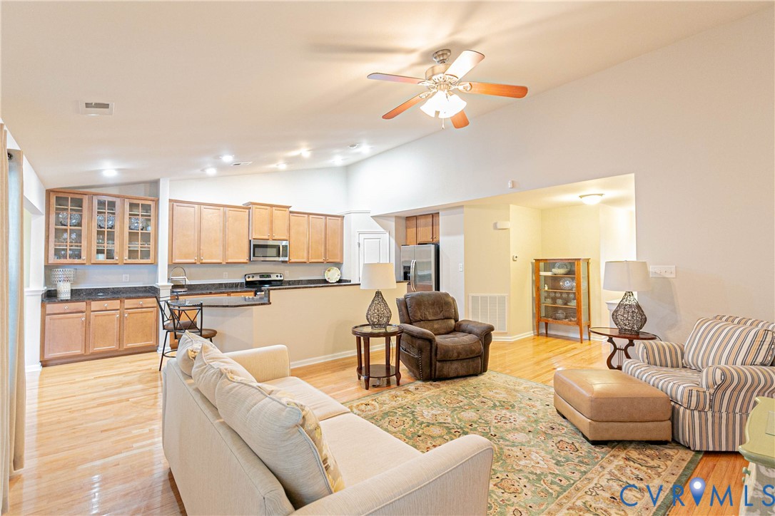 7533 South Franklins Way Quinton, VA 23141 - Photo 7 of 46 a living room with furniture and kitchen view