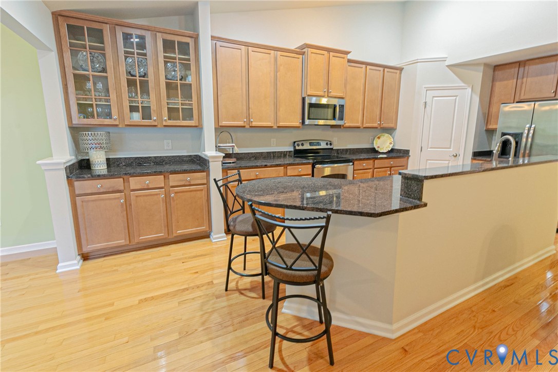 7533 South Franklins Way Quinton, VA 23141 - Photo 10 of 46 a kitchen with stainless steel appliances granite countertop a stove a sink cabinets and a refrigerator