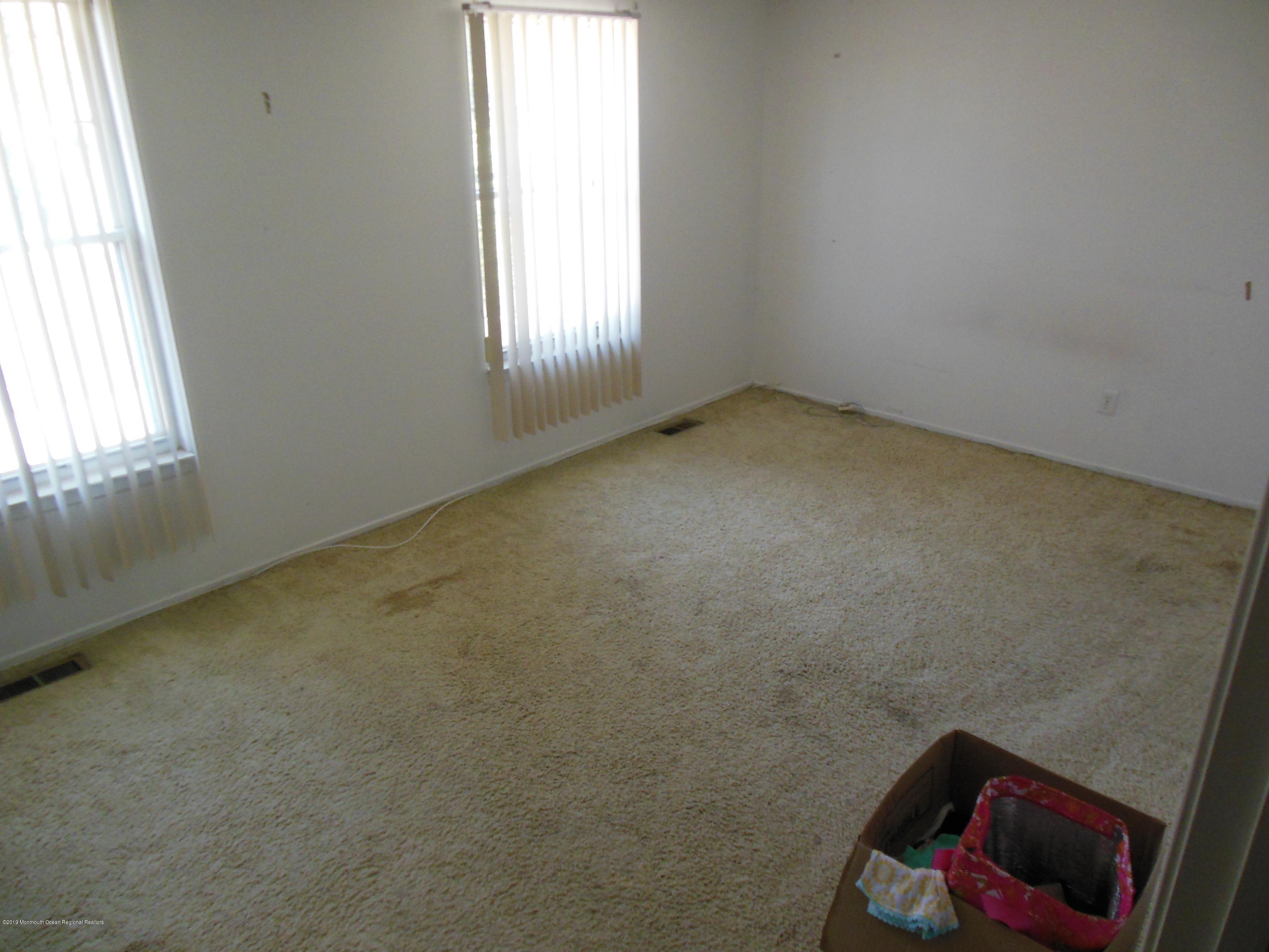859 Radio Road Little Egg Harbor, NJ 08087 - Photo 14 of 17 an empty room with windows