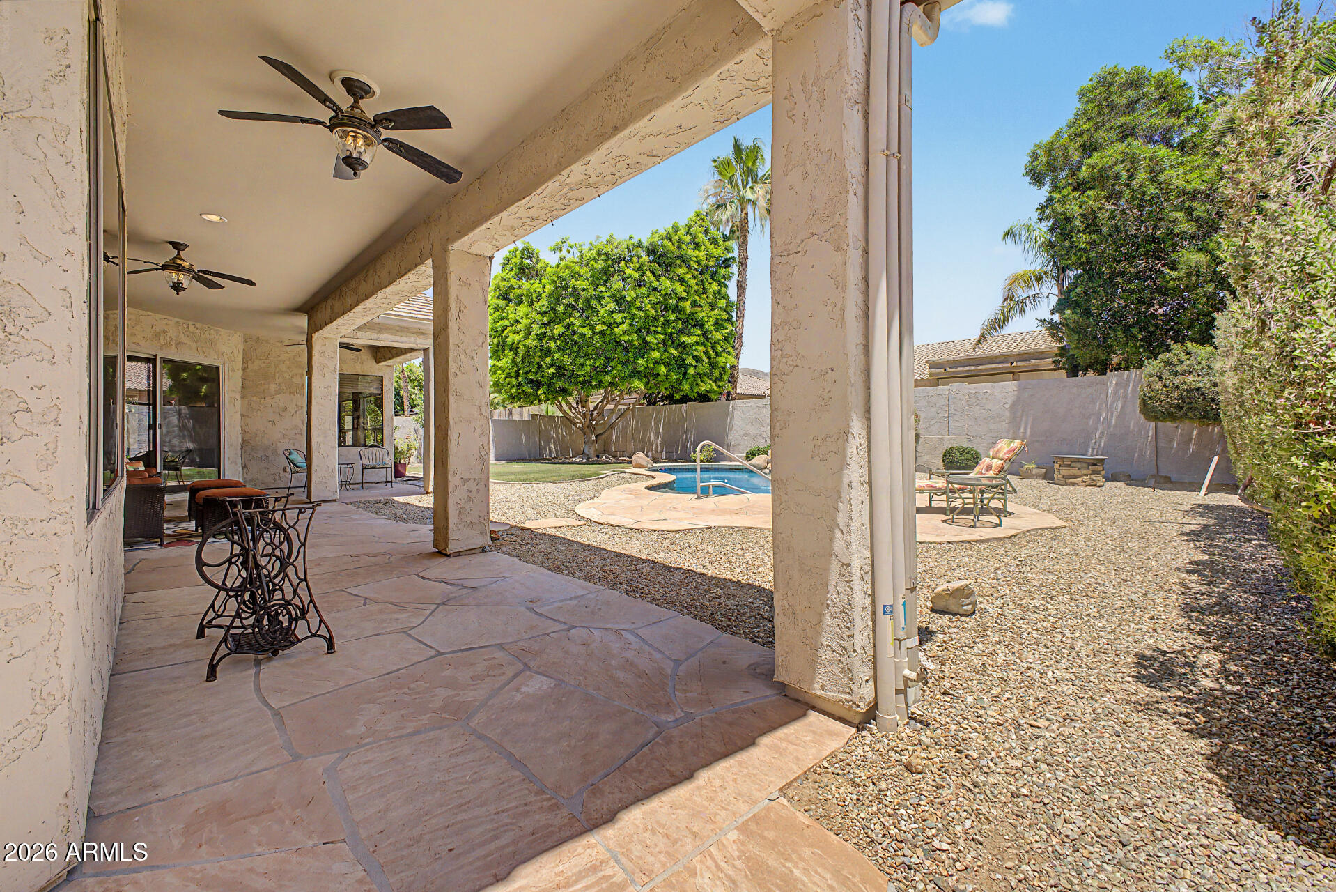 1632 West Frye Road Phoenix, AZ 85045 - Photo 27 of 37 a view of a porch with a table and chairs