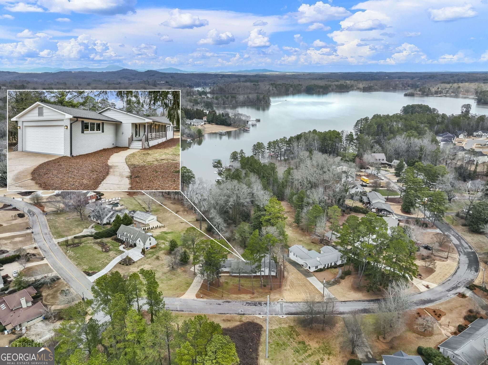 175 Thompson Place Gainesville, GA 30506 - Photo 16 of 32 a view of a lake with a mountain in the background