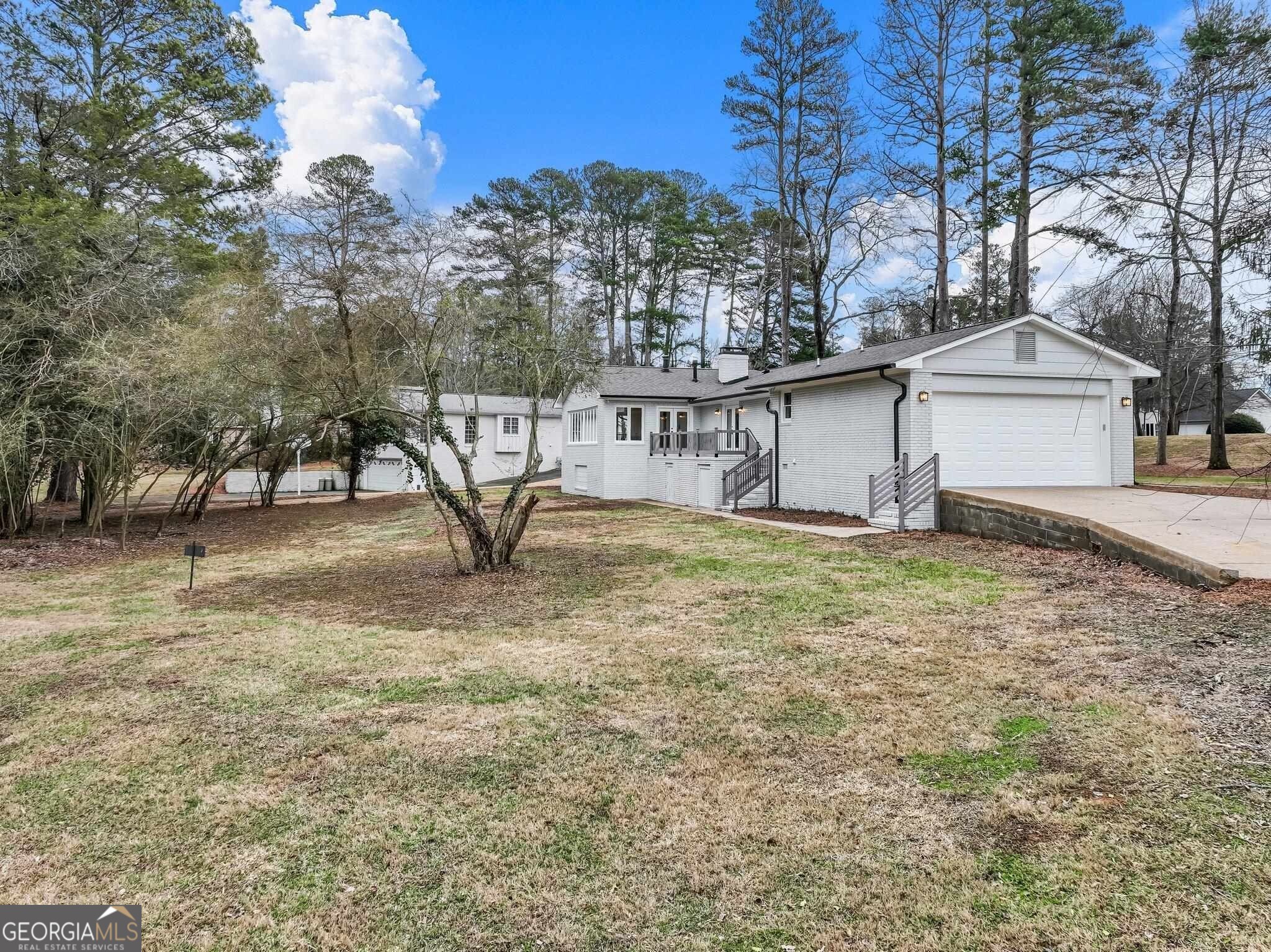 175 Thompson Place Gainesville, GA 30506 - Photo 18 of 32 a view of a house with a yard